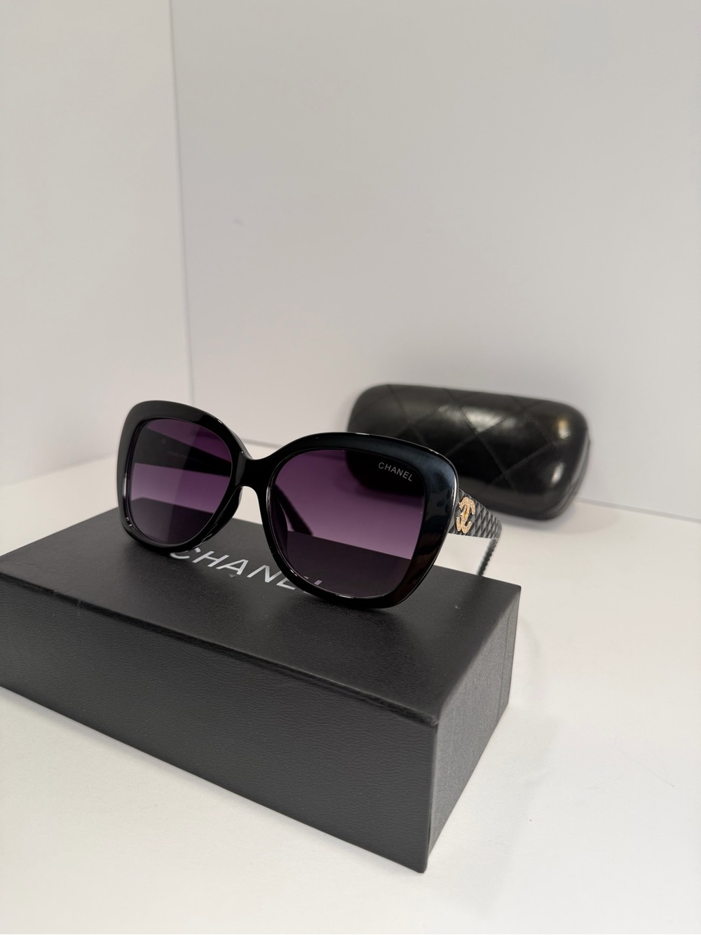 CHANEL Black Frame Sunglasses with Purple Gradient Lenses